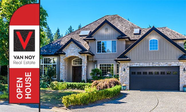 House with a Open House sign by The Van Noy Real Estate
