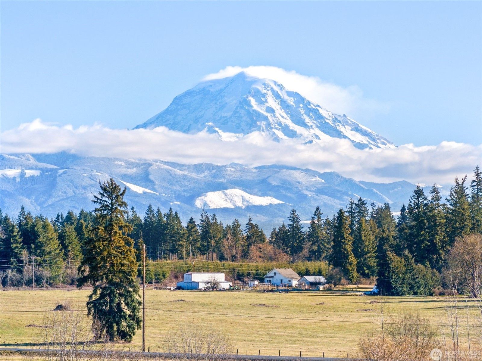 Mount Rainier over farmland near the Orting Highway in Puyallup, Washington