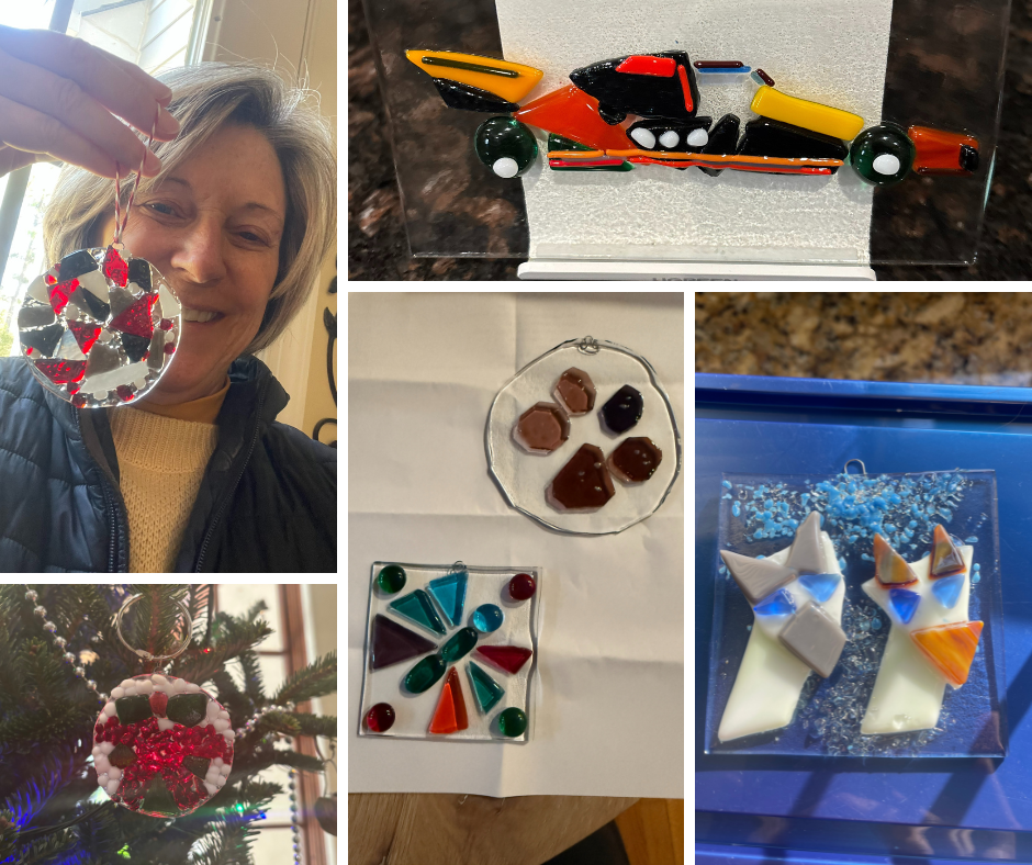 Colorful handmade glass ornaments and fused glass artwork displays, including Christmas tree decorations, a toy motorcycle, and abstract designs, showcasing holiday crafts and artistic glass creations.